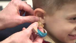 How to put in and remove an earmould hearing aid [upl. by Dalia478]